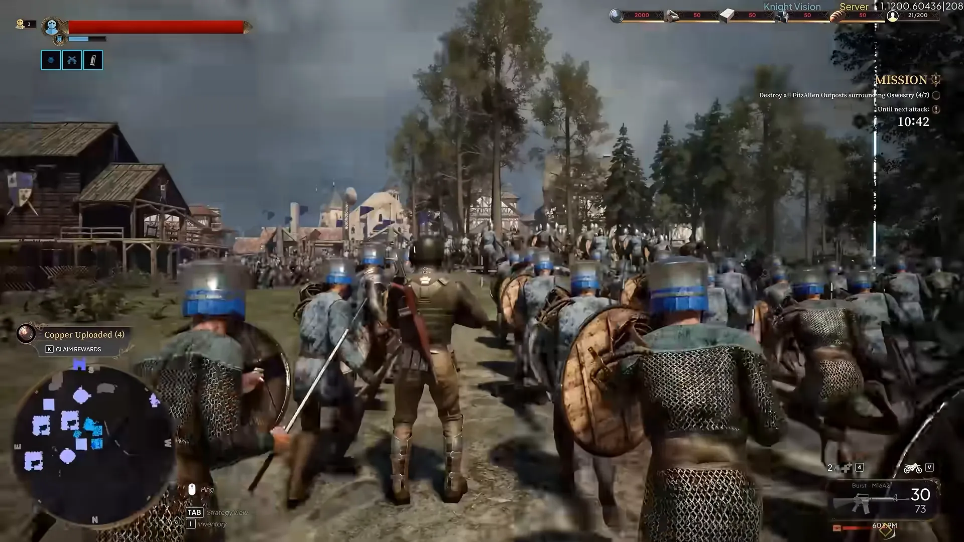 Third-person view behind a column of armoured soldiers in a village, with a minimap at the lower left.