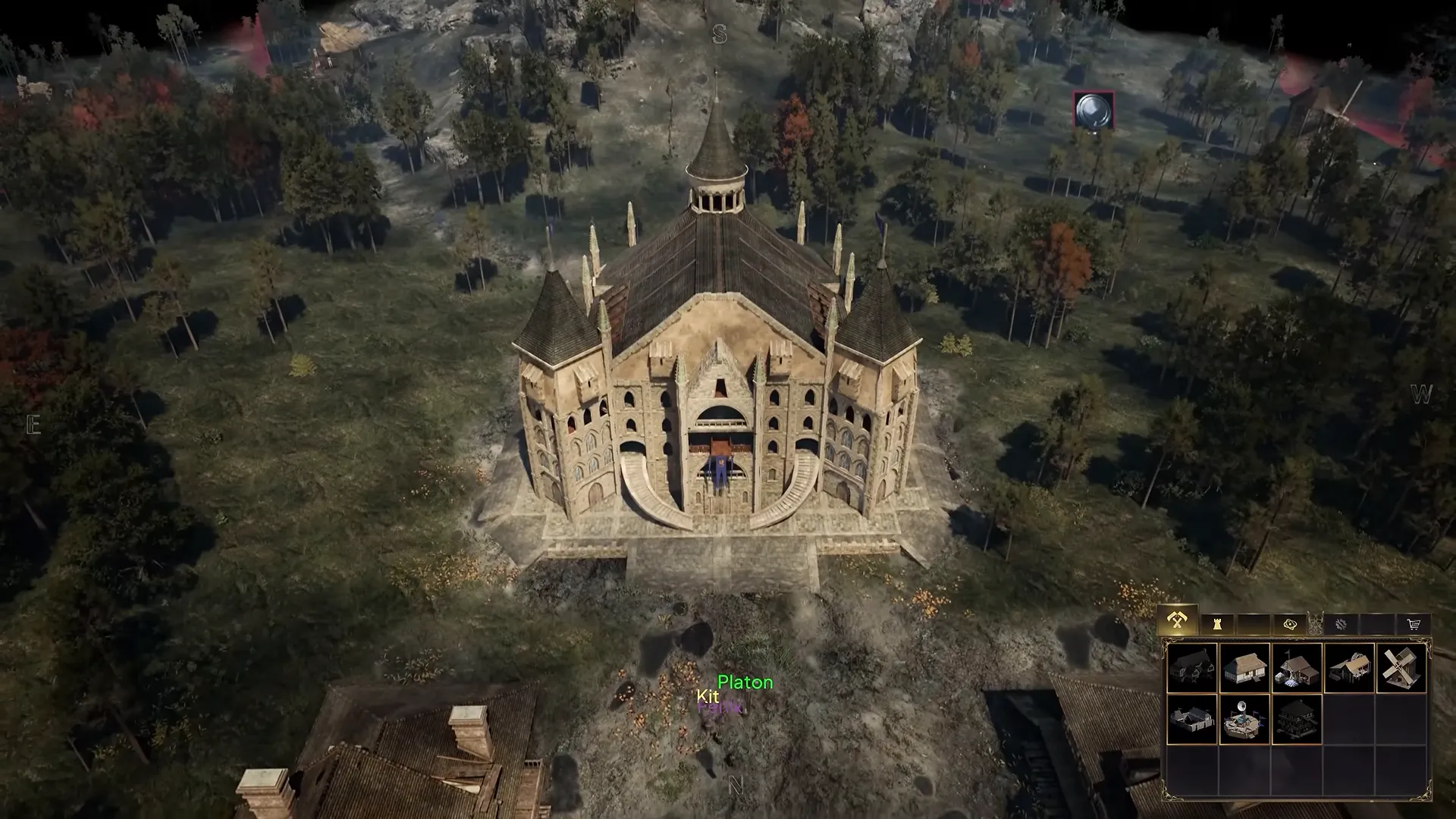 A large ornate stone building seen from above in the strategy view, surrounded by fields.