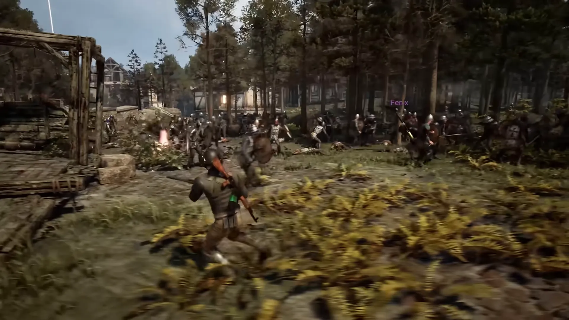 A soldier runs through ferns toward a large fight between soldiers at the edge of a forest.