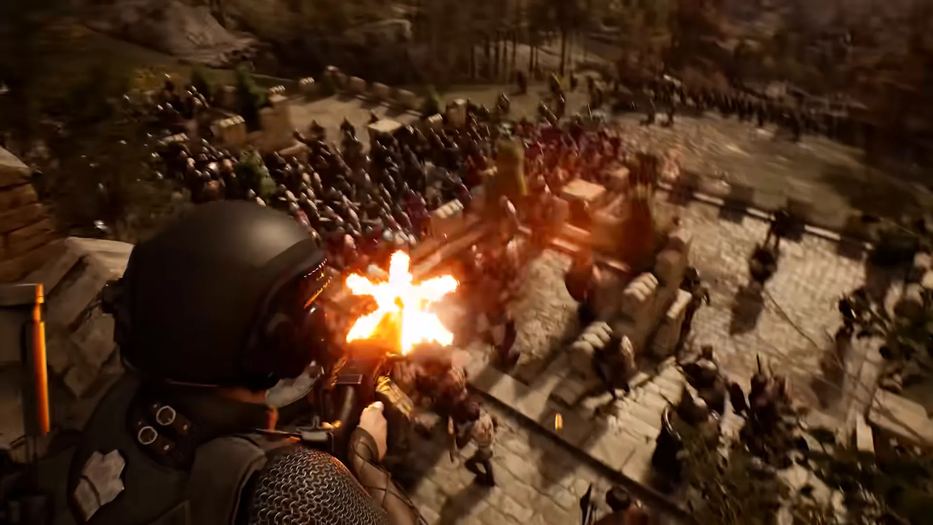 Muzzle flash as a soldier fires down into a dense crowd inside a wooden fort.