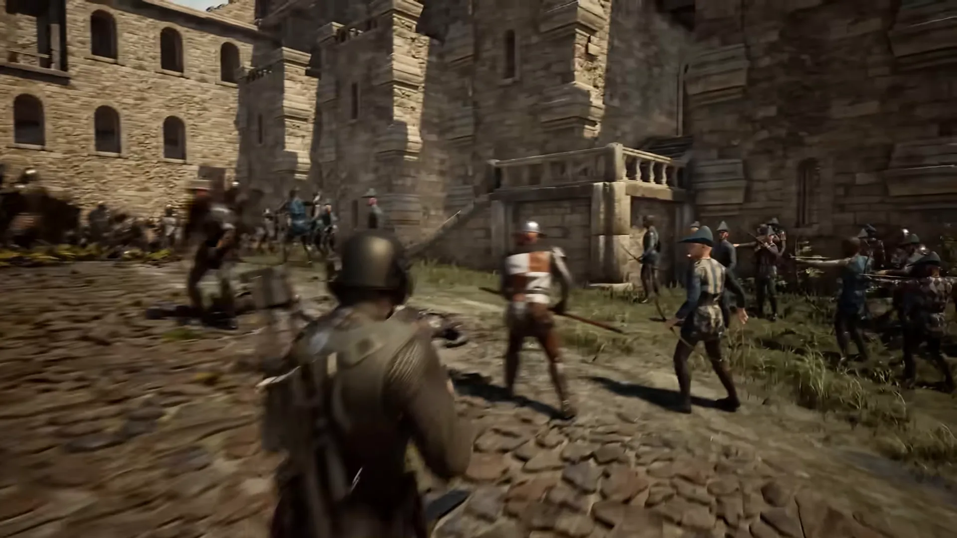 A helmeted soldier seen from behind faces enemy soldiers on a cobbled street below a stone castle wall; several on the right hold bows, and one in a red and white tabard holds a spear.