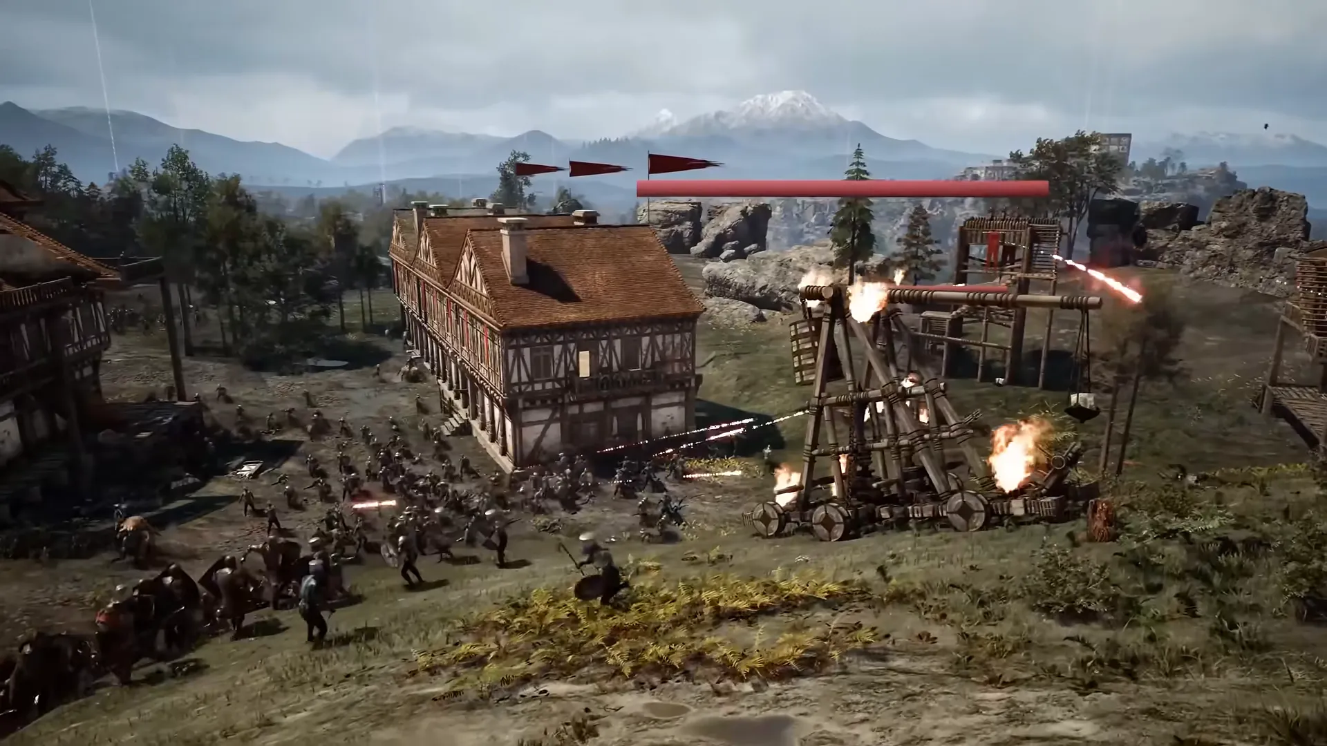 A trebuchet in action beside a timber house while troops fight around it.